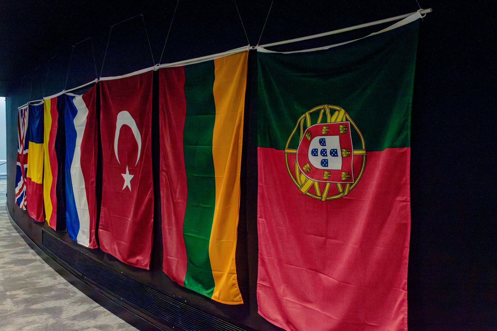 National flags hung along the wall of the Lisbon Scrimmage venue