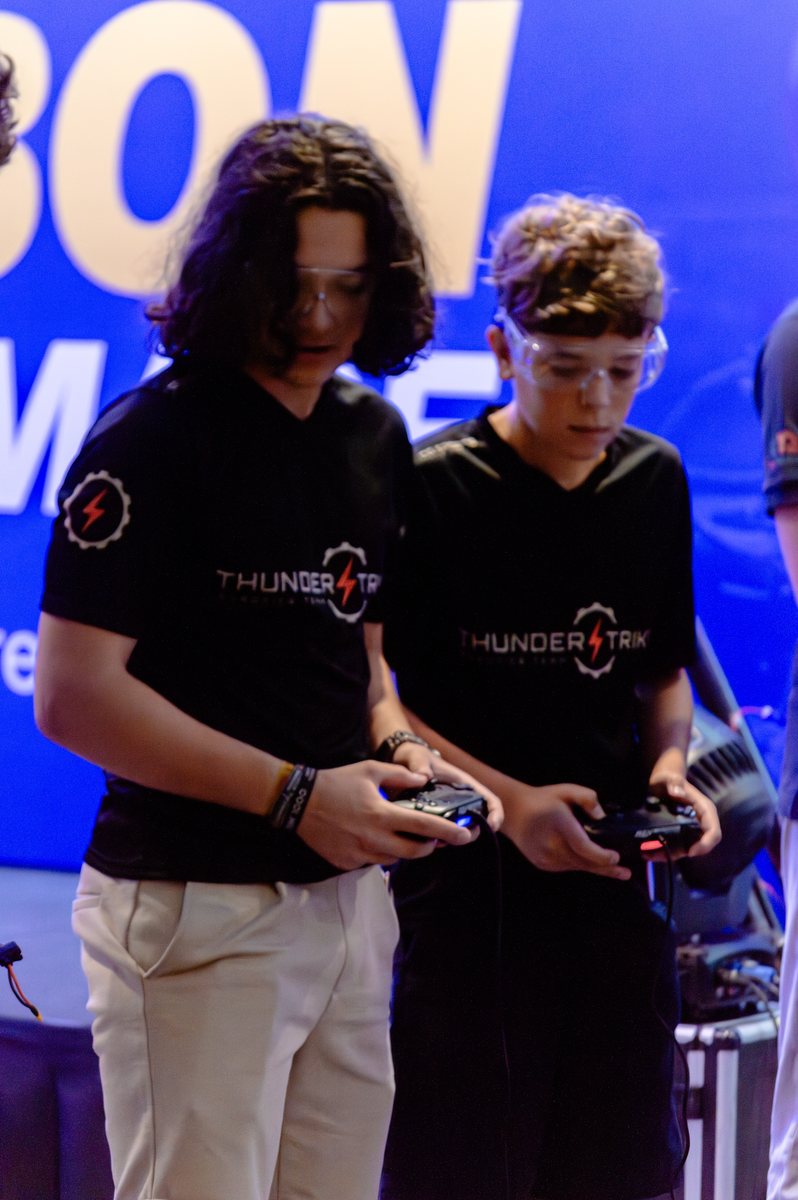 Thunderstrike's drive team at the controls during a match